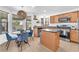 Bright breakfast nook with natural light, a stylish light fixture, and a round table for cozy dining at 756 Arden Valley Ave, Henderson, NV 89011