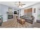 Comfortable living room with ceiling fan, tiled fireplace, and cozy seating, perfect for relaxation at 756 Arden Valley Ave, Henderson, NV 89011