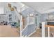 Hall with wood and white staircase leading to the second story of the home at 756 Arden Valley Ave, Henderson, NV 89011