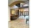 Spacious foyer with high ceilings, elegant columns, arched doorways, and decorative mirrors on the walls at 7625 Coley Ave, Las Vegas, NV 89117