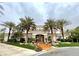 Stunning two-story home featuring lush landscaping, manicured grounds, and a circular driveway lined with mature palm trees at 7625 Coley Ave, Las Vegas, NV 89117