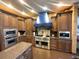 Gourmet kitchen with stainless steel appliances, and custom wood cabinetry at 7625 Coley Ave, Las Vegas, NV 89117