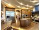 Open kitchen featuring stainless steel appliances, custom cabinets, and granite countertops at 7625 Coley Ave, Las Vegas, NV 89117