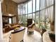 Elegant sunroom featuring a large window, fireplace, and seating area at 7625 Coley Ave, Las Vegas, NV 89117