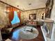 Elegant living room featuring a decorative fireplace, plush seating, and beautiful hardwood flooring at 7625 Coley Ave, Las Vegas, NV 89117
