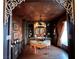 Ornately decorated home office with hardwood floors, chandelier, and custom built-ins at 7625 Coley Ave, Las Vegas, NV 89117