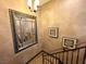 Close-up of the staircase with decorative wrought iron railing and a large mirror at 7625 Coley Ave, Las Vegas, NV 89117