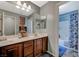 Bathroom featuring a double sink vanity and separate shower/tub at 7651 Anatolian St, Las Vegas, NV 89166