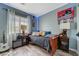bedroom with a bed, hardwood floors, and window at 7651 Anatolian St, Las Vegas, NV 89166