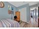 Bedroom featuring wood-look flooring, closet and door at 7651 Anatolian St, Las Vegas, NV 89166