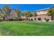 Green community lawn provides a shared open space in this neighborhood at 7651 Anatolian St, Las Vegas, NV 89166