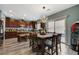 Dining area featuring an open floor plan to the kitchen and backyard access at 7651 Anatolian St, Las Vegas, NV 89166