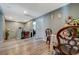 Open hallway features hardwood floors, a seating arrangement, and leads to various rooms of the home at 7651 Anatolian St, Las Vegas, NV 89166