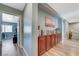 Hallway view with natural light, wood-like floors and built-in cabinets at 7651 Anatolian St, Las Vegas, NV 89166
