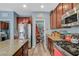 Spacious kitchen with stainless steel appliances, ample counter space, and a convenient walk-in pantry at 7651 Anatolian St, Las Vegas, NV 89166