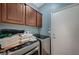 Functional laundry room featuring modern machines, cabinetry, and efficient use of space at 7651 Anatolian St, Las Vegas, NV 89166