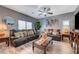 Living room boasts comfortable leather couches and wood floors at 7651 Anatolian St, Las Vegas, NV 89166