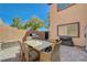 Paver patio features an outdoor dining area and a stainless steel grill at 7651 Anatolian St, Las Vegas, NV 89166