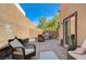 Beautiful backyard patio with brick pavers, outdoor furniture, and built-in seating at 7651 Anatolian St, Las Vegas, NV 89166