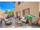 Beautiful backyard patio with brick pavers, outdoor furniture, and palm tree at 7651 Anatolian St, Las Vegas, NV 89166