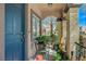 Inviting front porch with chairs, plants, and charming decor at 7651 Anatolian St, Las Vegas, NV 89166