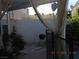 Enclosed backyard featuring stone patio, barbecue, and well-maintained landscaping at 7840 Millhopper Ave, Las Vegas, NV 89128