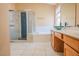 Bright bathroom with a shower, tub, and ample counter space at 7840 Millhopper Ave, Las Vegas, NV 89128