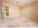 Empty bedroom features neutral walls and carpet at 7840 Millhopper Ave, Las Vegas, NV 89128