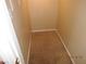 A walk-in closet featuring carpeted flooring and ample space for storage at 7840 Millhopper Ave, Las Vegas, NV 89128