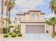Attractive two-story house with well-maintained landscaping and a spacious two-car garage at 7840 Millhopper Ave, Las Vegas, NV 89128