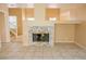 Living area features a modern fireplace and tile flooring at 7840 Millhopper Ave, Las Vegas, NV 89128