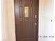 Elegant front door with decorative glass panel and security features at 7840 Millhopper Ave, Las Vegas, NV 89128