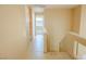 Hallway with wooden cabinets, leading towards other rooms at 7840 Millhopper Ave, Las Vegas, NV 89128