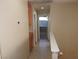 Hallway with built-in cabinets leading to a window at 7840 Millhopper Ave, Las Vegas, NV 89128