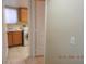 Well-equipped laundry room featuring a sink, cabinets, and modern washer and dryer at 7840 Millhopper Ave, Las Vegas, NV 89128