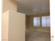 Bright living space with tile flooring and large windows bringing in plenty of natural light at 7840 Millhopper Ave, Las Vegas, NV 89128