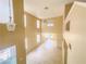 Open living space with high ceilings, multiple windows, and modern ceiling fan creating a bright, airy atmosphere at 7840 Millhopper Ave, Las Vegas, NV 89128