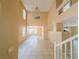 Bright living room with tile flooring, high ceilings, and large windows offering ample natural light at 7840 Millhopper Ave, Las Vegas, NV 89128
