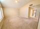 Cozy living room featuring neutral tones and carpet flooring, bathed in natural light at 7840 Millhopper Ave, Las Vegas, NV 89128