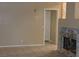 Neutral living room with fireplace and tile floors providing a bright and airy space at 7840 Millhopper Ave, Las Vegas, NV 89128