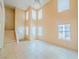 Open floor plan living room featuring high ceilings and large windows at 7840 Millhopper Ave, Las Vegas, NV 89128