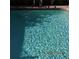 Clean, inviting swimming pool featuring clear water and tiled bottom in the backyard at 7840 Millhopper Ave, Las Vegas, NV 89128