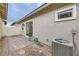 View of patio with air conditioning unit, pavers and gravel at 790 Sunny Sagebrush St, Henderson, NV 89011