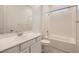 Bright bathroom features a vanity with sink and a shower-tub combo at 790 Sunny Sagebrush St, Henderson, NV 89011