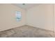 Neutral-toned bedroom with a carpeted floor and a window providing natural light at 790 Sunny Sagebrush St, Henderson, NV 89011