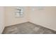Well-lit bedroom features a plush carpet and bright neutral paint at 790 Sunny Sagebrush St, Henderson, NV 89011