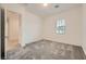Neutral-toned bedroom with carpeted floor and view of hallway and en suite bathroom at 790 Sunny Sagebrush St, Henderson, NV 89011