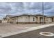 Low-angle view of a well-maintained house featuring a brick-accented facade, complementing the surrounding landscape at 790 Sunny Sagebrush St, Henderson, NV 89011