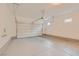 Spacious garage with concrete flooring and an automatic door opener at 790 Sunny Sagebrush St, Henderson, NV 89011
