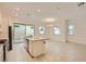 Bright kitchen and dining area features a granite countertop, stainless appliances, and tile flooring at 790 Sunny Sagebrush St, Henderson, NV 89011